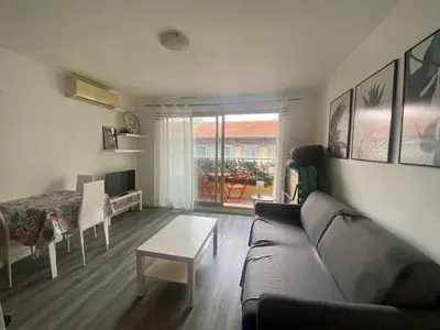 a living room with a couch and a table at Studio Nice Centre garibaldi port plage in Nice