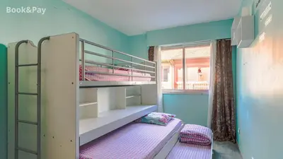 a bedroom with two bunk beds and a window at La Providence in Nice