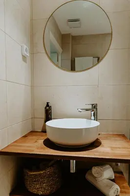 a bathroom with a white sink and a mirror at Palm Boutique Hôtel Nice in Nice