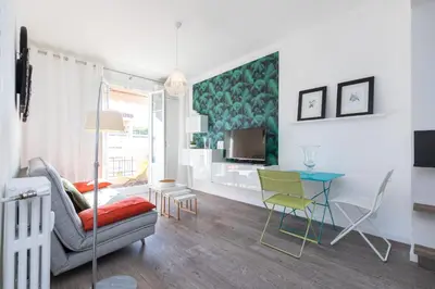 a living room with a couch and a table at Cosy 1 Bdr near Garibaldi Square - Top Floor & AC in Nice