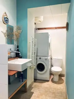 a bathroom with a washing machine and a washer at Apartment Claudia - Central -Quiet- Near the Sea- AC- Private Parking in Nice