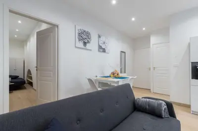 a living room with a couch and a table at Historical Apartment Hyper Center in Nice