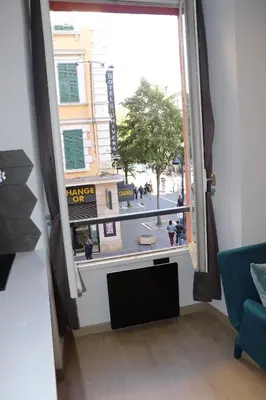 a large window with a view of a city street at Historical Apartment Hyper Center in Nice