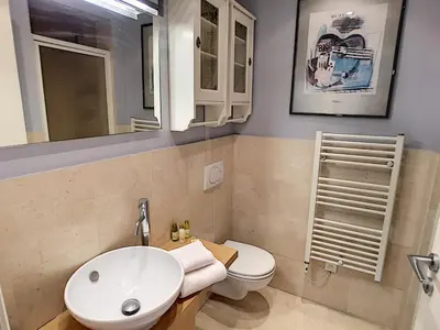 a bathroom with a sink and a toilet and a mirror at Nestor&Jeeves - ANGEL'S BAY - City center - Close beaches in Nice