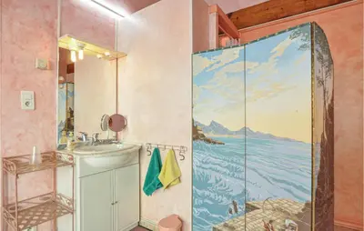 a bathroom with a shower with a painting on the wall at Amazing Home In Cagnes Sur Mer in Cagnes-sur-Mer