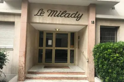 a entrance to a building with a sign on it at studio centre nice proche de mer in Nice