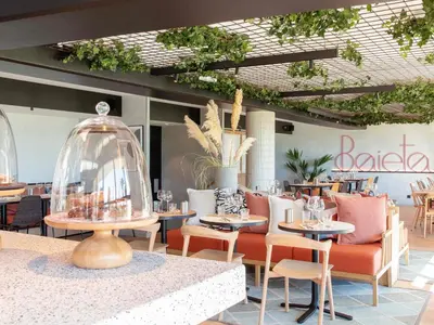 a restaurant with tables and chairs and a glass dome at ibis Nice Aéroport Promenade des Anglais in Nice