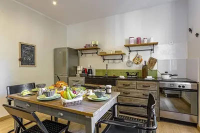 a kitchen with a table with food on it at MY CASA - GAMBETTA - Charming 2 bedroom - Near Promenade in Nice