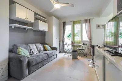 a living room with a couch and a table at Cosy Studio at Nice Port in Nice