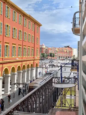 a view from a balcony of a city with buildings at Jean in Nice