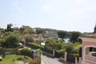 a view from the balcony of a house with a river at Villa Artemys - Five Stars Holiday House in Saint-Jean-Cap-Ferrat