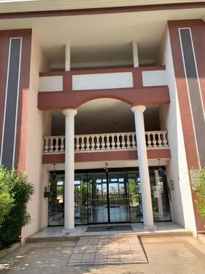 an entrance to a building with columns at Appartement agréable en bord de mer in Villefranche-sur-Mer