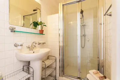 a bathroom with a sink and a shower at Ambassador Palace AP2095 by Riviera Holiday Homes in Nice