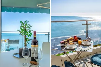 a table with a bottle of wine and a plate of food at MY CASA - PROM 199 - Spacious studio - Promenade - Sea View in Nice