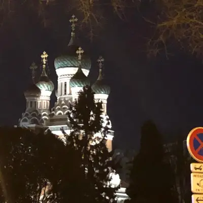 a church with domes lit up at night at Le Palladium quartier Tzaréwitch Nice in Nice