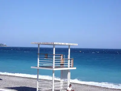 a lifeguard tower on the beach near the ocean at Nizza - Boutique Wohnung - near Hotel Negresco in Nice