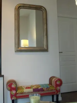 a mirror on a wall with a couch in a room at Nizza - Boutique Wohnung - near Hotel Negresco in Nice