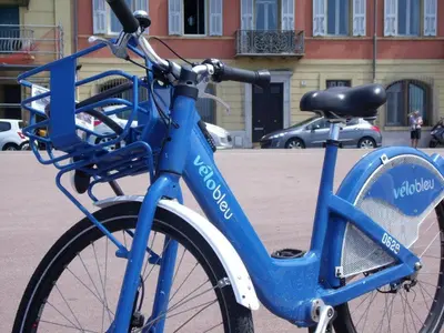 a blue bike parked on the side of a street at Nizza - Boutique Wohnung - near Hotel Negresco in Nice