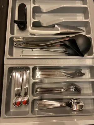 a drawer with silver utensils in a refrigerator at PALAIS ELISABETH PROMENADE DES ANGLAIS in Nice