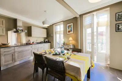 a kitchen with a table with a yellow and white table cloth at Vue Magenta AP4188 by Riviera Holiday Homes in Nice