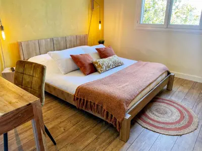a bed with pillows on it in a bedroom at Villa Angel in La Gaude