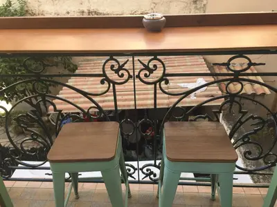 a pair of chairs sitting on top of a iron fence at Chic and Cosy apartment GV Port Garibaldi in Nice