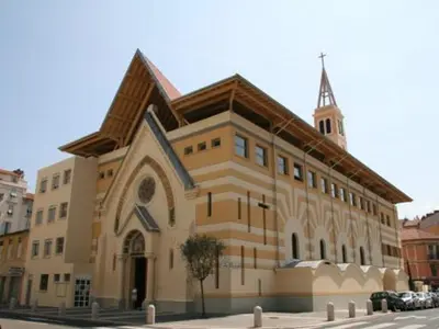 a large building with a church with a steeple at Chic and Cosy apartment GV Port Garibaldi in Nice