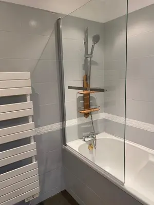 a bathroom with a shower with a bath tub at Chic and Cosy apartment GV Port Garibaldi in Nice