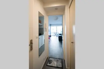 a hallway with a door leading to a room at STUDIO ORANGERS in Nice