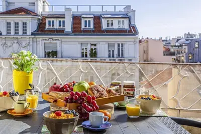 a tray of food on a table on a balcony at MY CASA - FLEURS 22 - City Center - Modern w Terrace in Nice