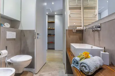 a bathroom with a toilet and a sink at MY CASA - FLEURS 22 - City Center - Modern w Terrace in Nice