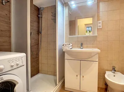 a bathroom with a sink and a washing machine at Nestor&Jeeves - LIDO BEACH - Central - Very close sea - Pedestrian zone in Nice