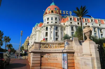 a large white building with a sign on it at Nestor&Jeeves - LIDO BEACH - Central - Very close sea - Pedestrian zone in Nice