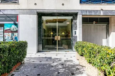 a store front with a sign in the window at MASSENET PIETONNE AP4196 by Riviera Holiday Homes in Nice