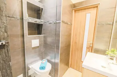 a bathroom with a shower and a toilet and a sink at MASSENET PIETONNE AP4196 by Riviera Holiday Homes in Nice