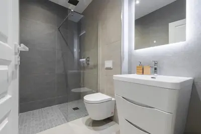 a bathroom with a shower and a toilet and a sink at HEROLD Balcon in Nice