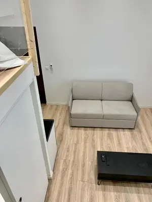 a small living room with a couch in a room at Gustave 2 in Nice