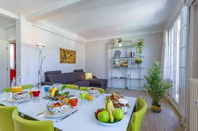 a living room with a table with food on it at MY CASA - BERLIOZ 1 - City Center 2 rooms - Balcony in Nice