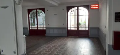 an empty hallway with two doors and two windows at Large beautiful studio near the NEGRESCO HOTEL in Nice