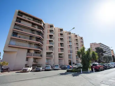 an old building with a door in a street at Studio Le Baccara by Interhome in Cagnes-sur-Mer