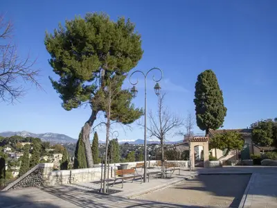 a large apartment building with cars parked in a parking lot at Studio Le Baccara by Interhome in Cagnes-sur-Mer