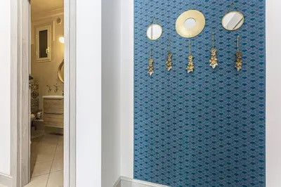 a bathroom with a blue tile wall with chandeliers at MY CASA - DIJON - Near Train Station - Malaussena in Nice