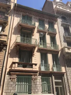 a building with balconies on the side of it at Le GIULIANO in Nice