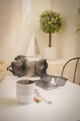 a table with a pair of sunglasses on a table at Charmant Studio climatisé - Vieux Nice in Nice