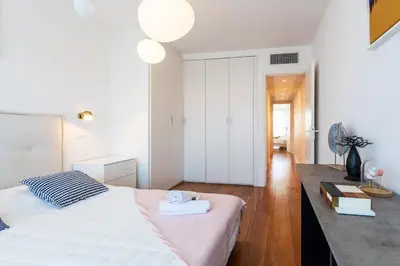 a bedroom with a bed with two towels on it at LE FRANCIA II AP4197 By RIVIERA HOLIDAY HOMES in Nice