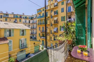 a balcony with a view of a building at MY CASA - GUISOL - Typical Nice 3 Bedroom AC near Port in Nice