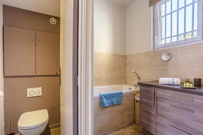 a bathroom with a toilet and a bath tub at MY CASA - GUISOL - Typical Nice 3 Bedroom AC near Port in Nice