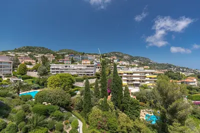a view of a city with trees and buildings at Sea View Park Swimming Pool & Tennis 2 Bdrs in Villefranche-sur-Mer