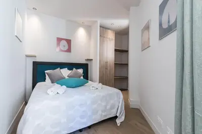 a bedroom with a bed with towels on it at Refined & Cozy 1 Bedroom Downtown in Nice