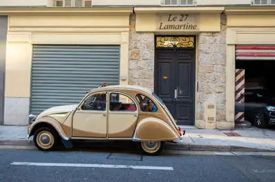a small car parked in front of a building at LAMARTINE- Heart of Center- Modern and Design flat in Nice